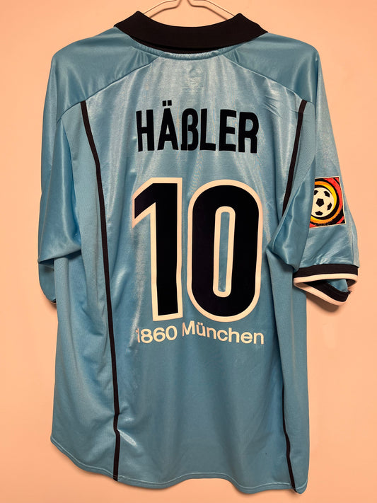 Blue football jersey with 'Häbler' and number '19' on a beige background