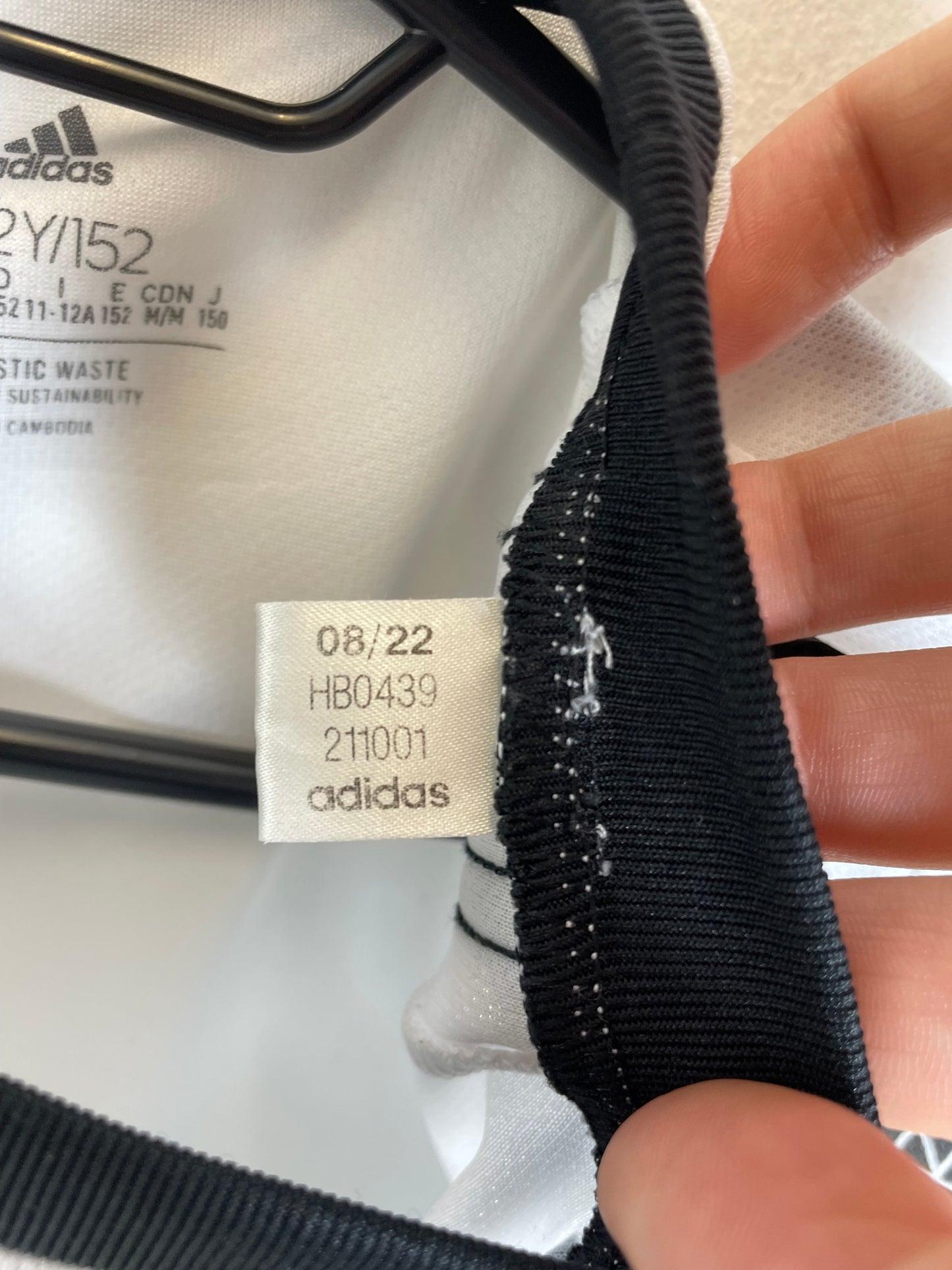 Interior care label and size tag showing 11-12Y on Adidas Juventus 2022/23 home shirt