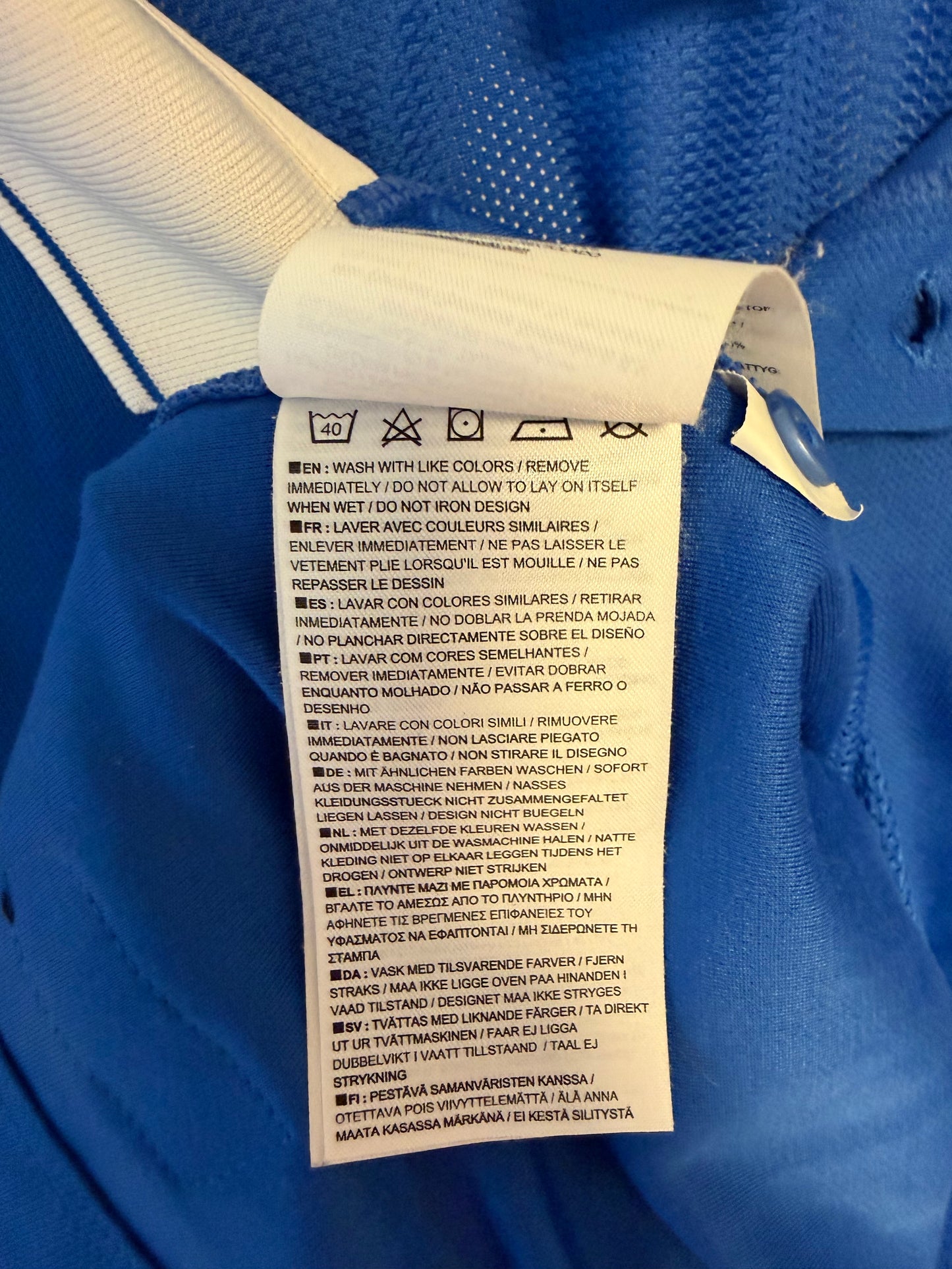 Close-up fabric texture and stitching quality detail of Nike Molde FK 2014 European home jersey