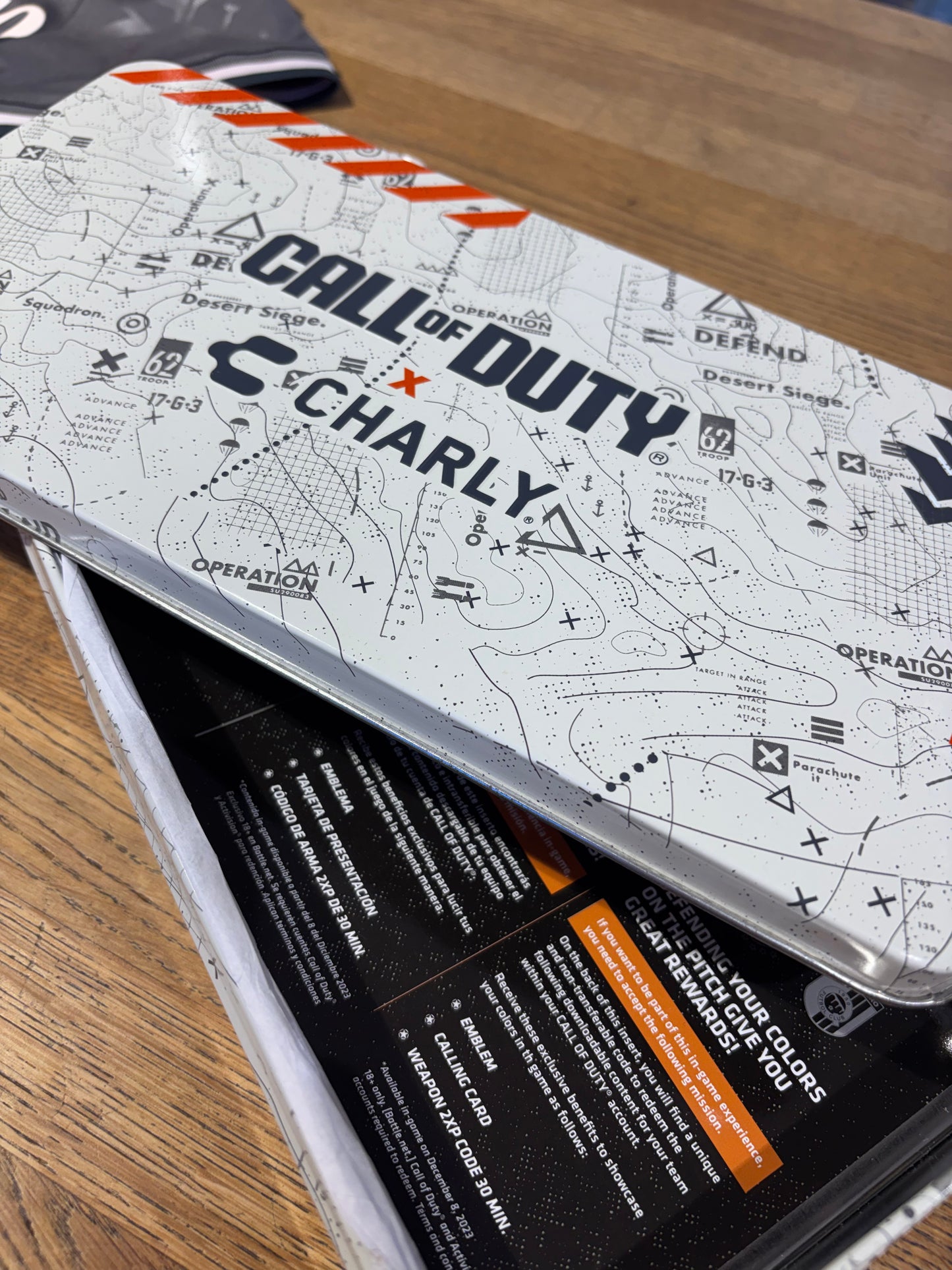 Phone case with 'Call of Duty' design on a wooden surface