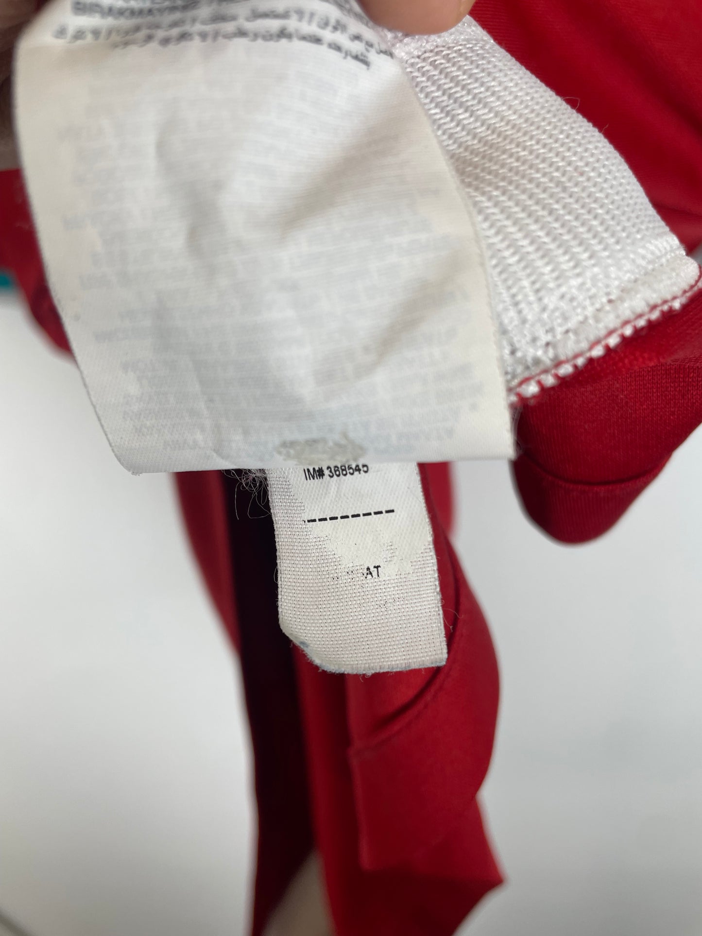 Liverpool FC 20/21 home jersey interior size label and Nike manufacturing tags in medium