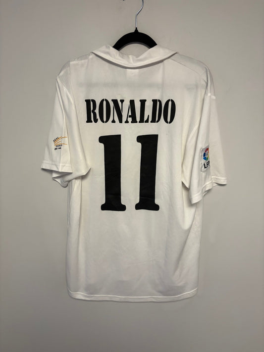 Front view of the Real Madrid 02/03 home shirt showing the club crest and Adidas stripes, photographed at our Stavanger store