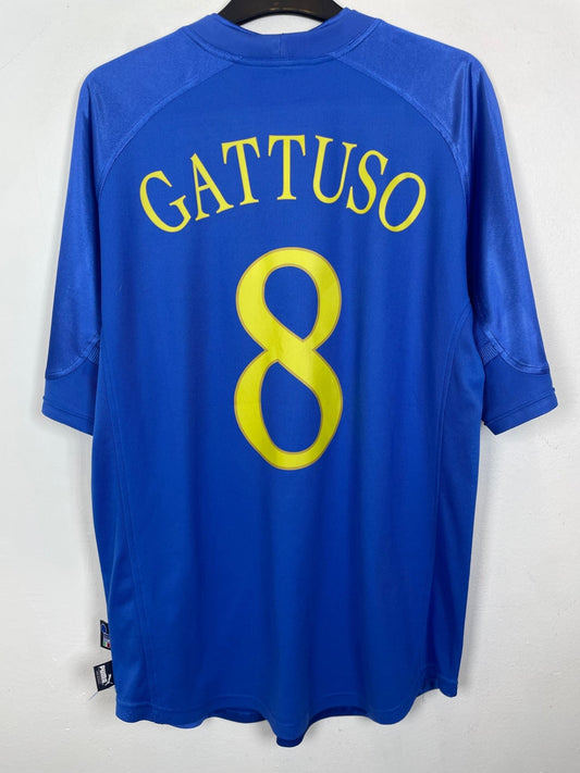 Front view of the Italy 04/06 home shirt showing the FIGC national badge and Puma logo, photographed at our Stavanger store