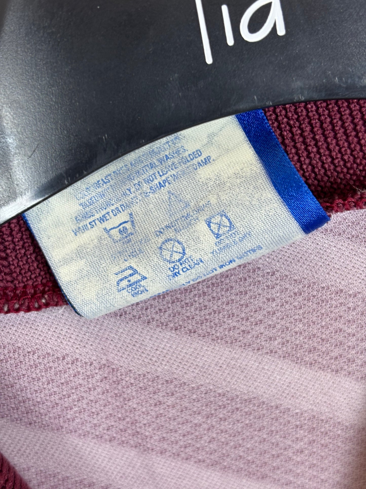 Care label and sizing tag showing Umbro branding on Manchester City 1996/97 away shirt