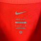 Close-up of Nike logo and Brighton club badge on white 22/23 away shirt with Trossard 11
