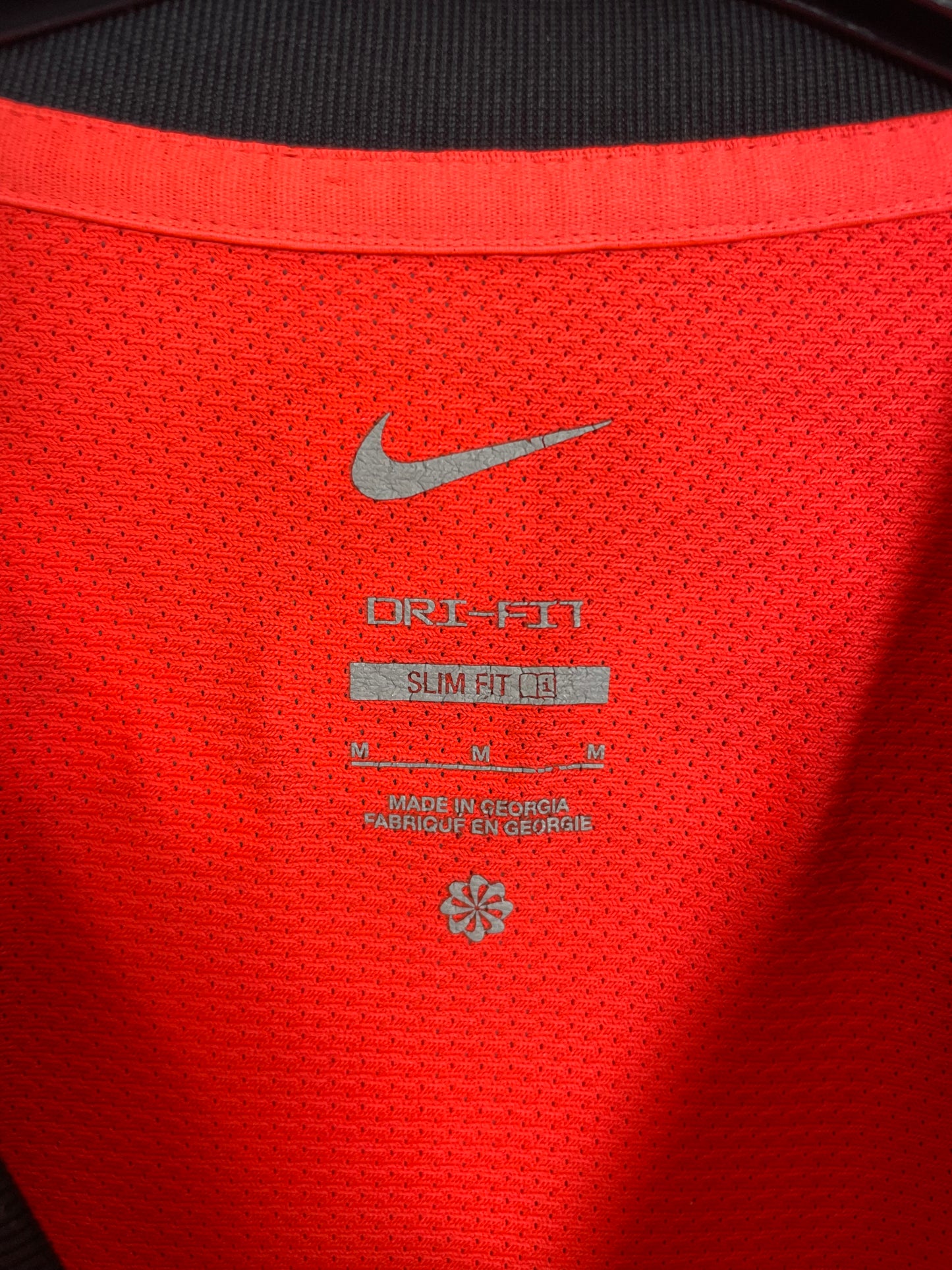 Close-up of Nike logo and Brighton club badge on white 22/23 away shirt with Trossard 11