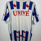 White sports jersey with blue and red designs on a white background