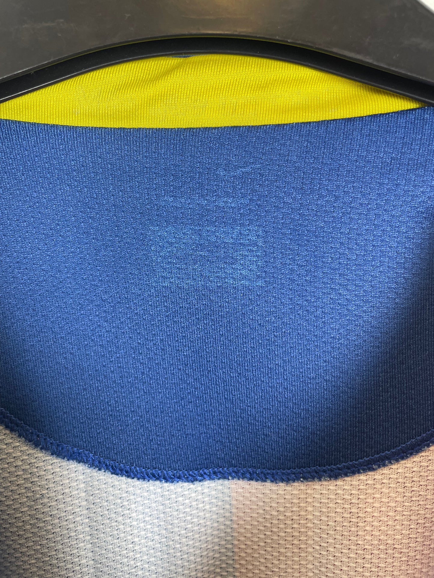 Close-up of Barcelona club crest and Nike swoosh logo on 06/07 home shirt stripes