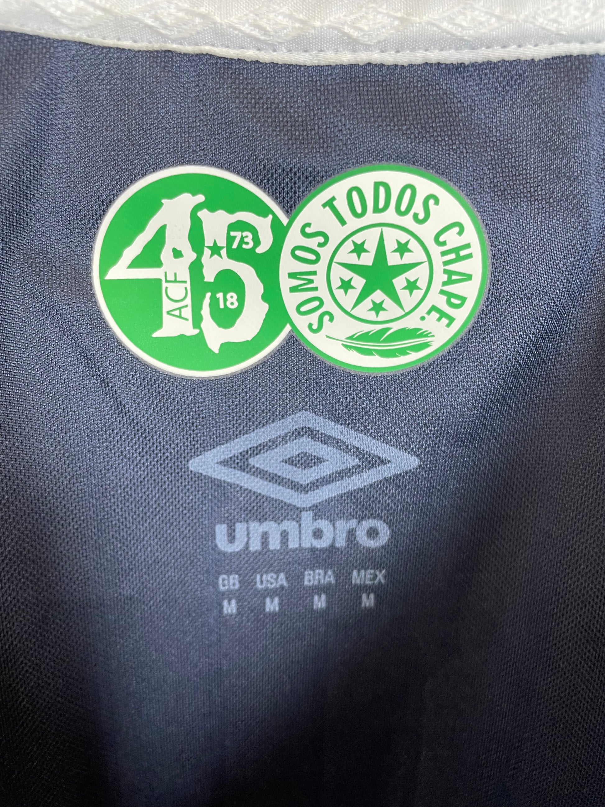 Close-up of Umbro logo and Chapecoense club badge on 2018 third shirt detail