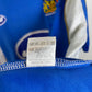 Close-up of a Wigan Athletic Home 06/07 with a label and visible brand logo.