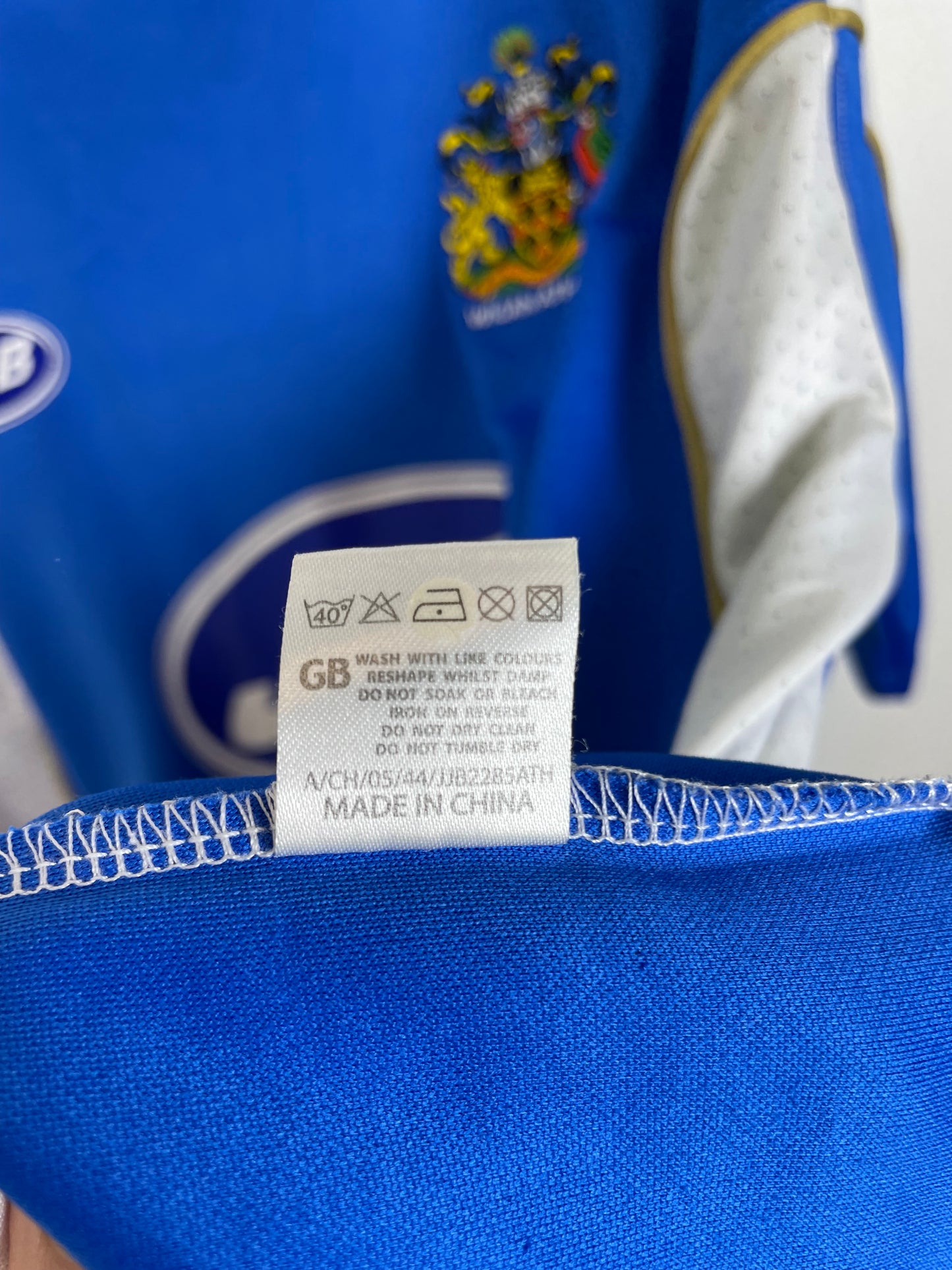 Close-up of a Wigan Athletic Home 06/07 with a label and visible brand logo.