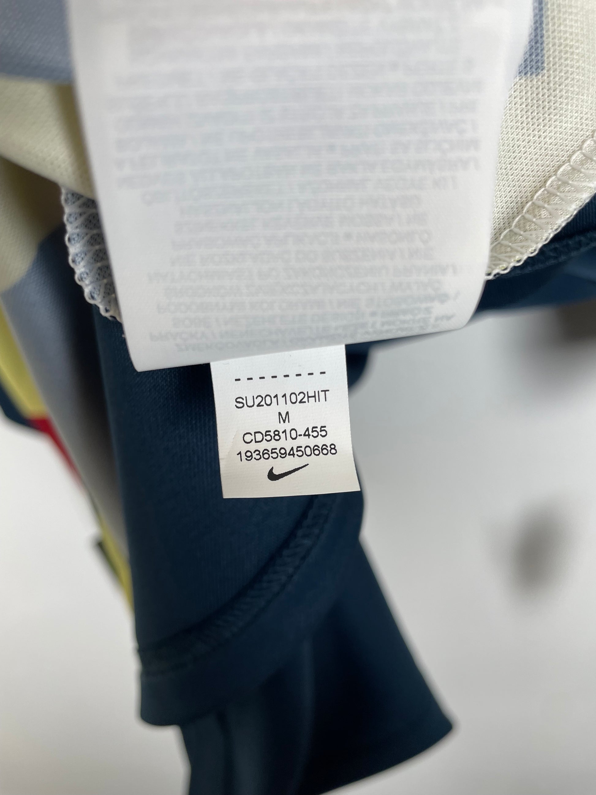 Interior care label and Nike branding details on Club América 20/21 pre-match training shirt