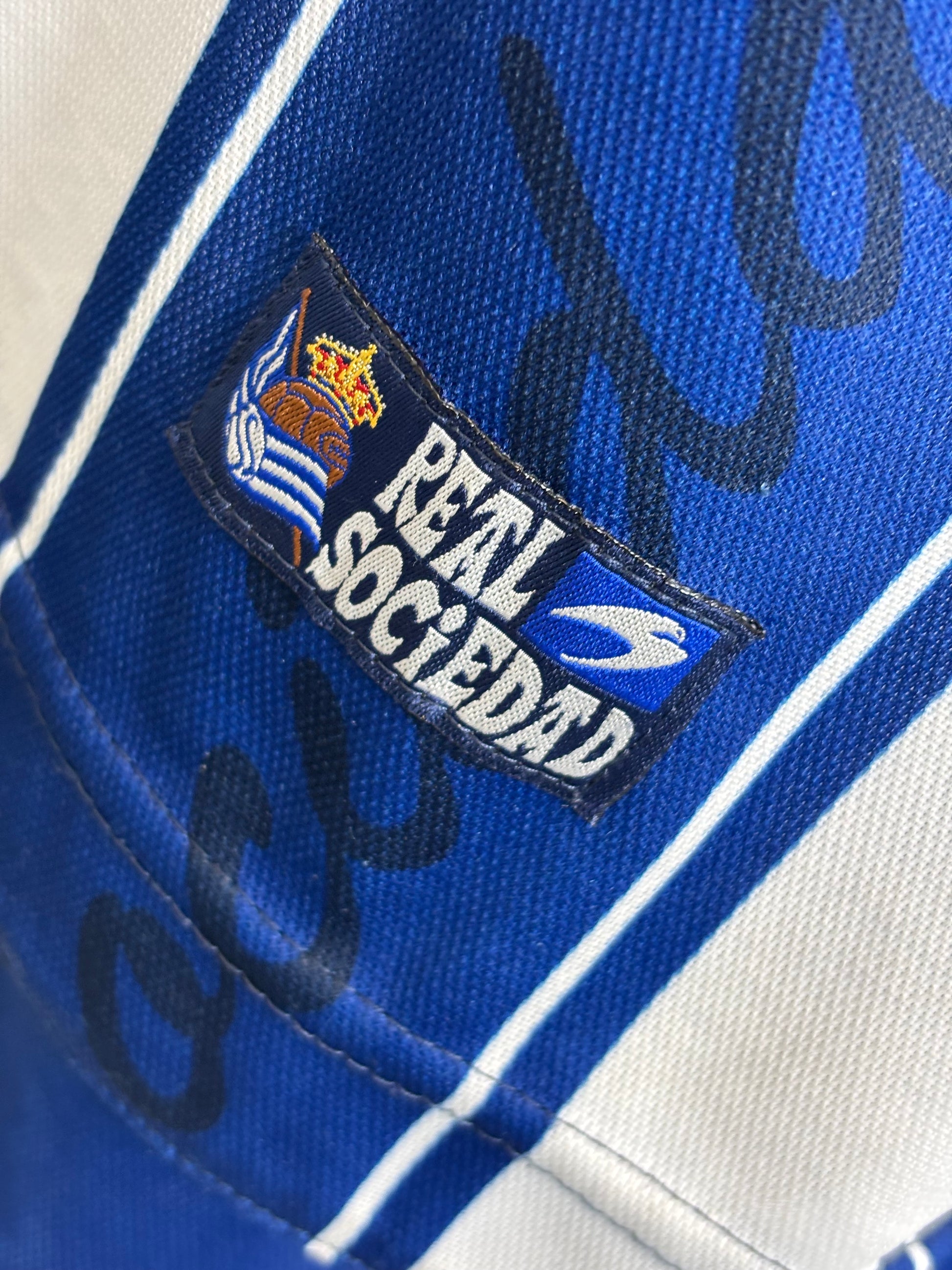Care instructions and size L label visible inside Astore Real Sociedad 2000/01 home jersey