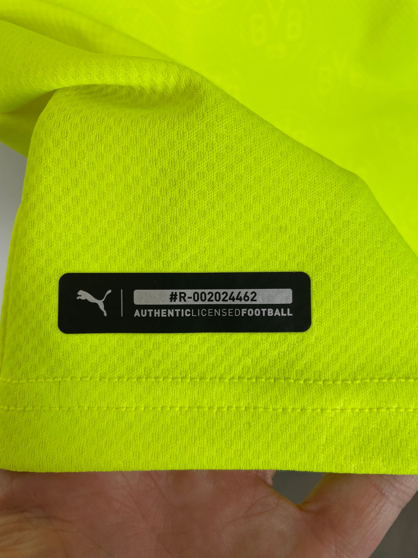 Interior care label and sizing details of Puma Dortmund 21/22 third jersey with fabric composition