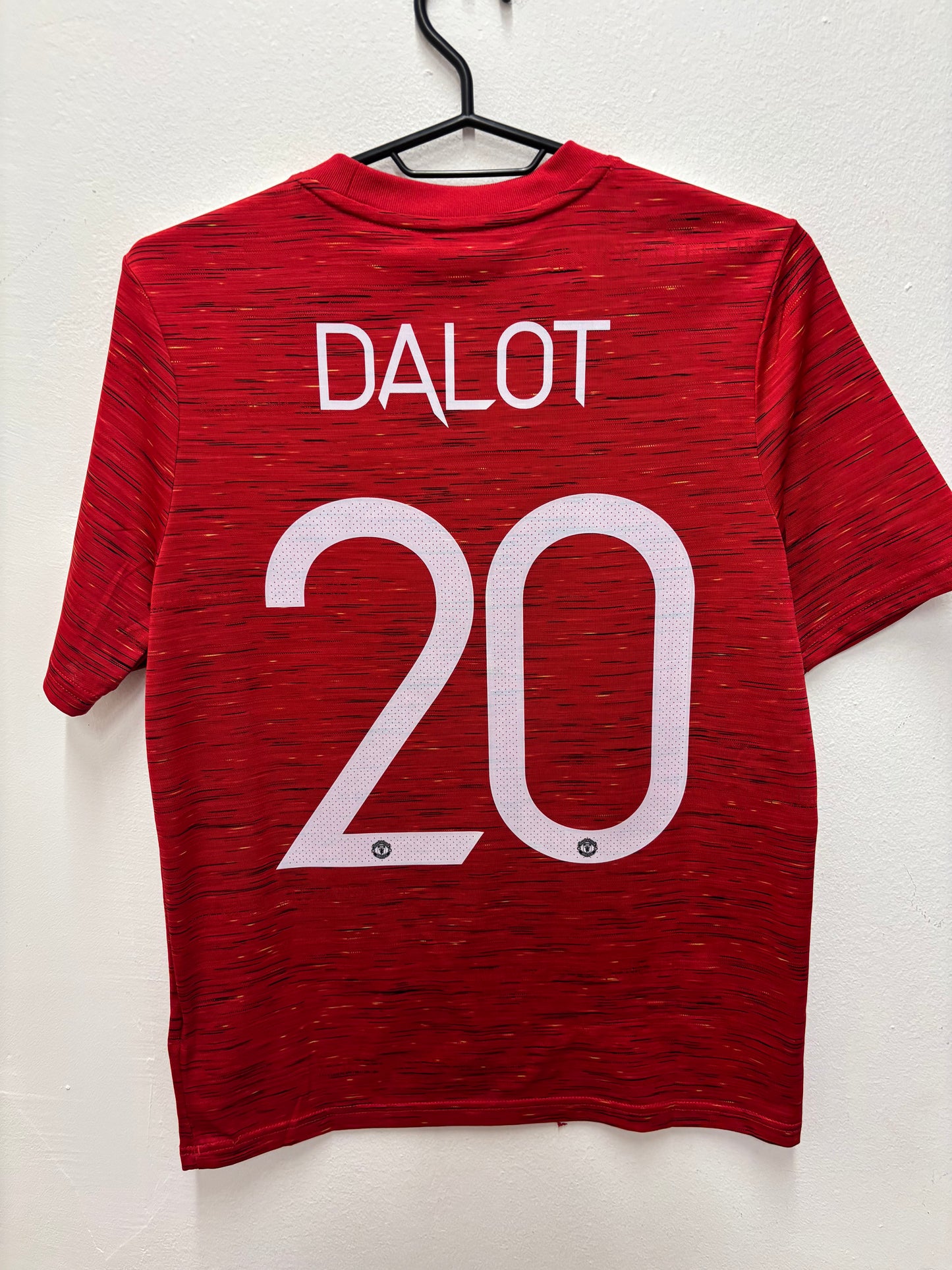 Back view of Adidas Manchester United 20/21 home shirt showing Dalot name and number 20
