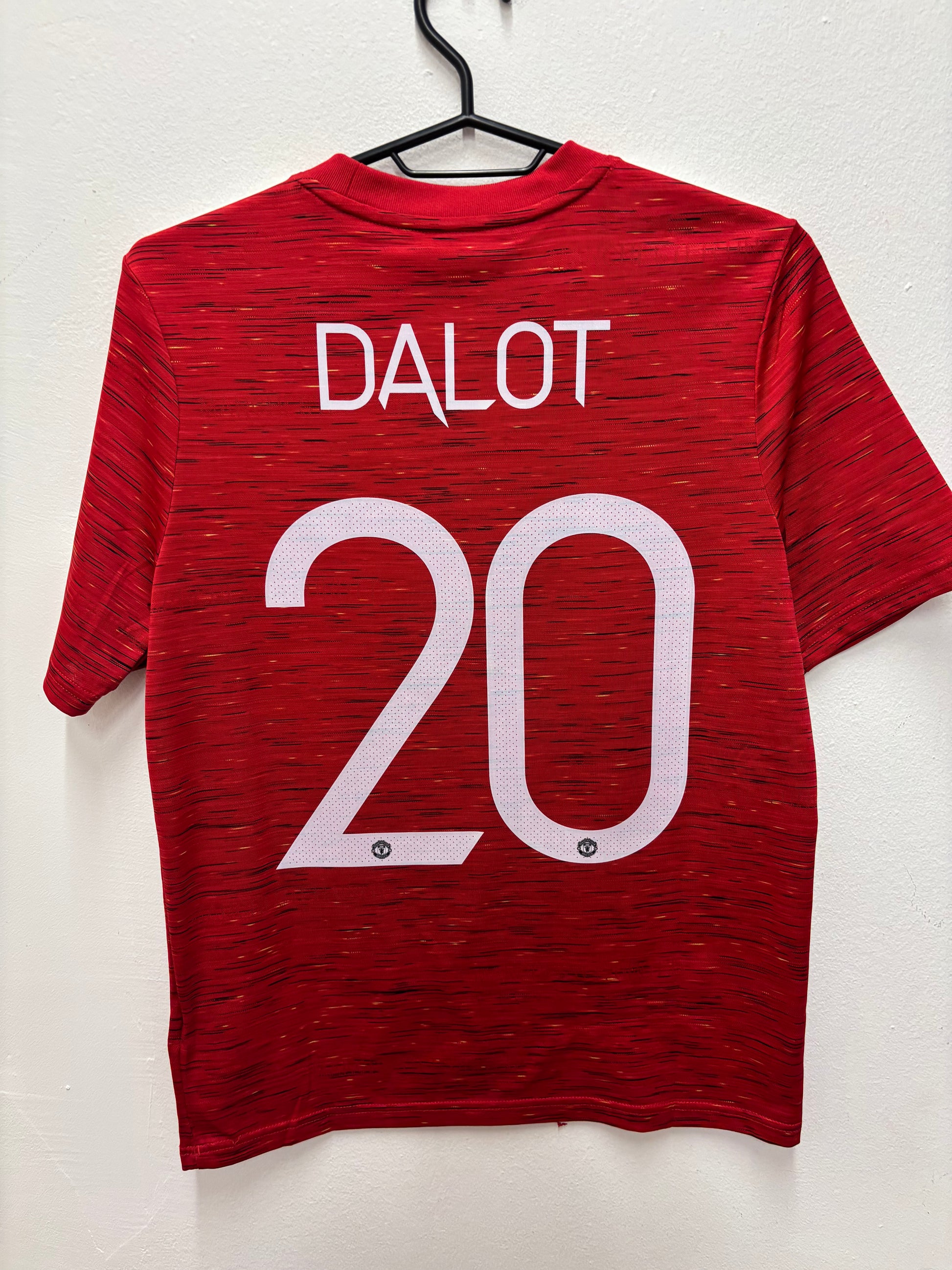 Back view of Adidas Manchester United 20/21 home shirt showing Dalot name and number 20