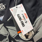 Close-up of a label on a jacket with branding details.