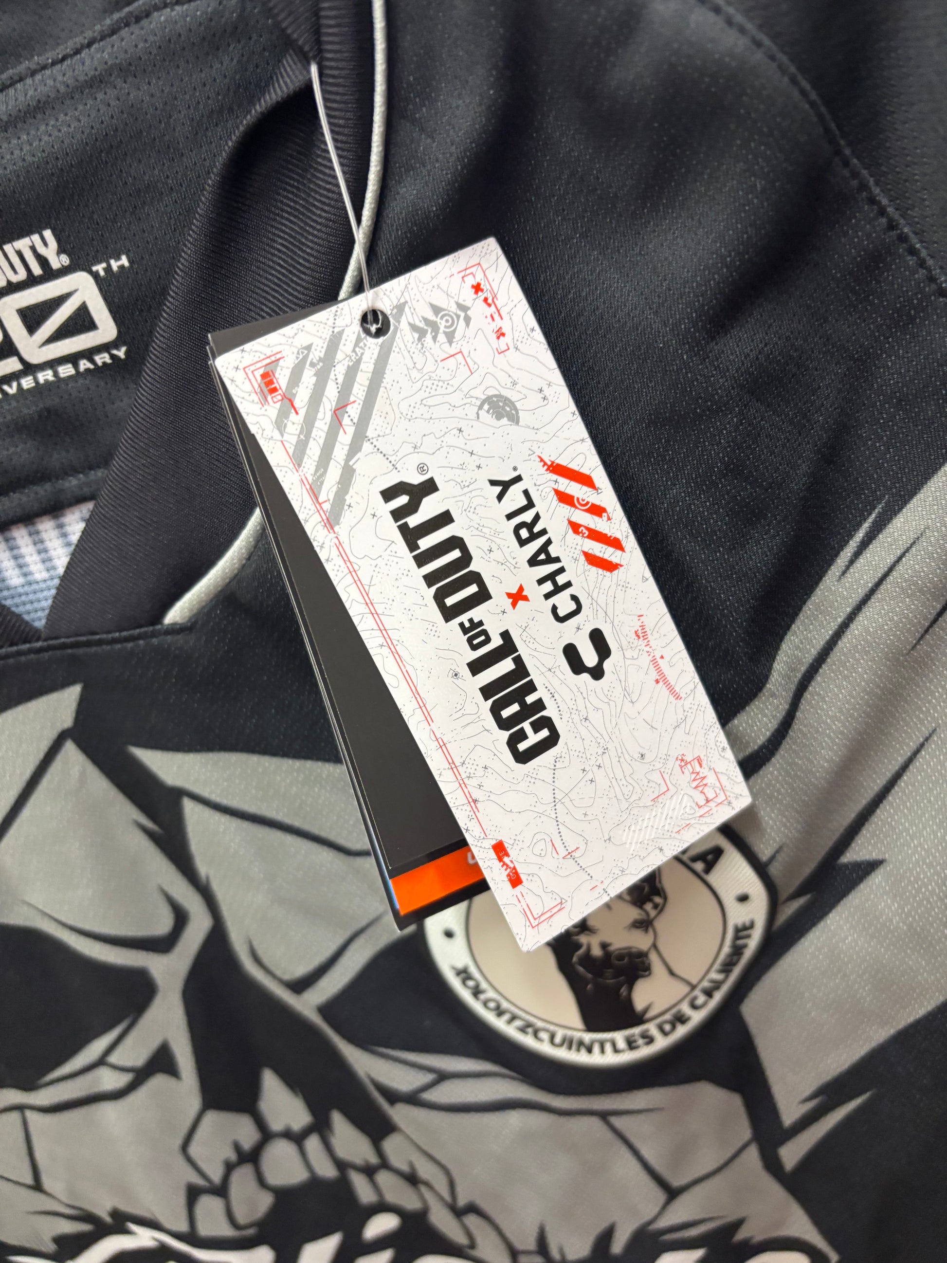 Close-up of a label on a jacket with branding details.