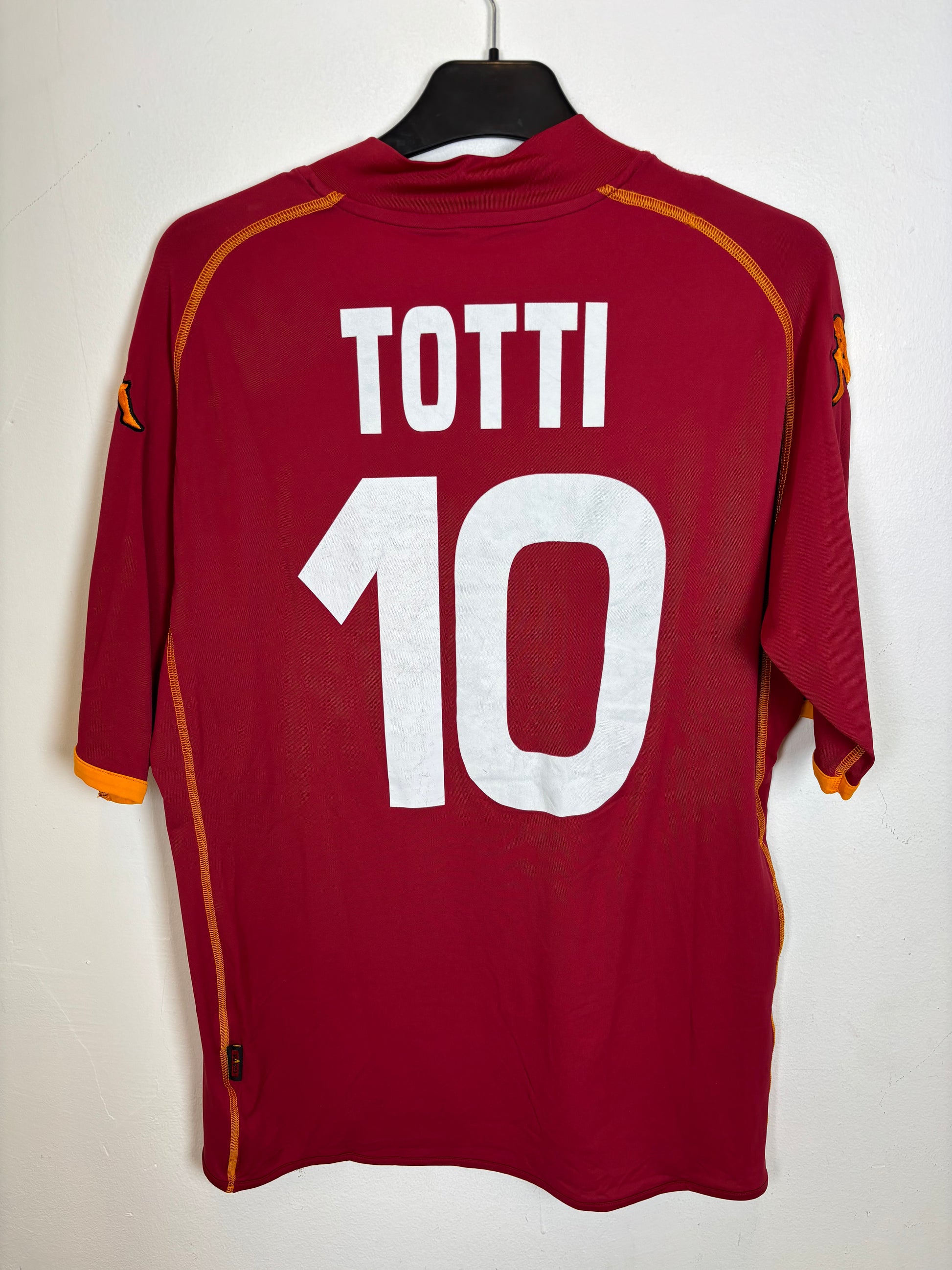 Back view of AS Roma 08/09 home shirt showing Totti name and number 10 in white lettering on red fabric
