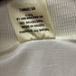 Close-up of a label on a Grêmio away 1992 vintage shirt with text