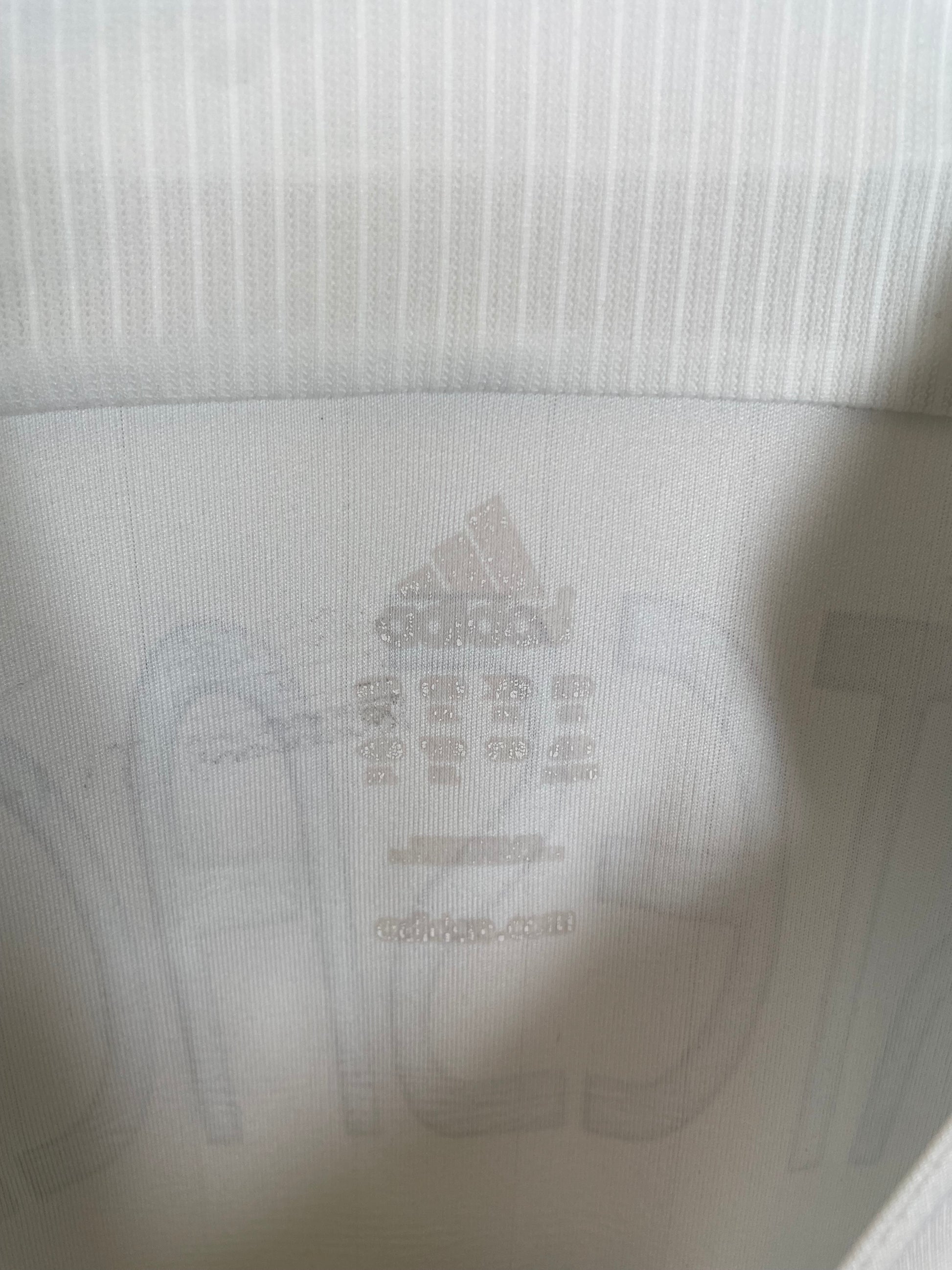 German Football Association eagle badge and Adidas three stripes logo on 2006 World Cup home shirt