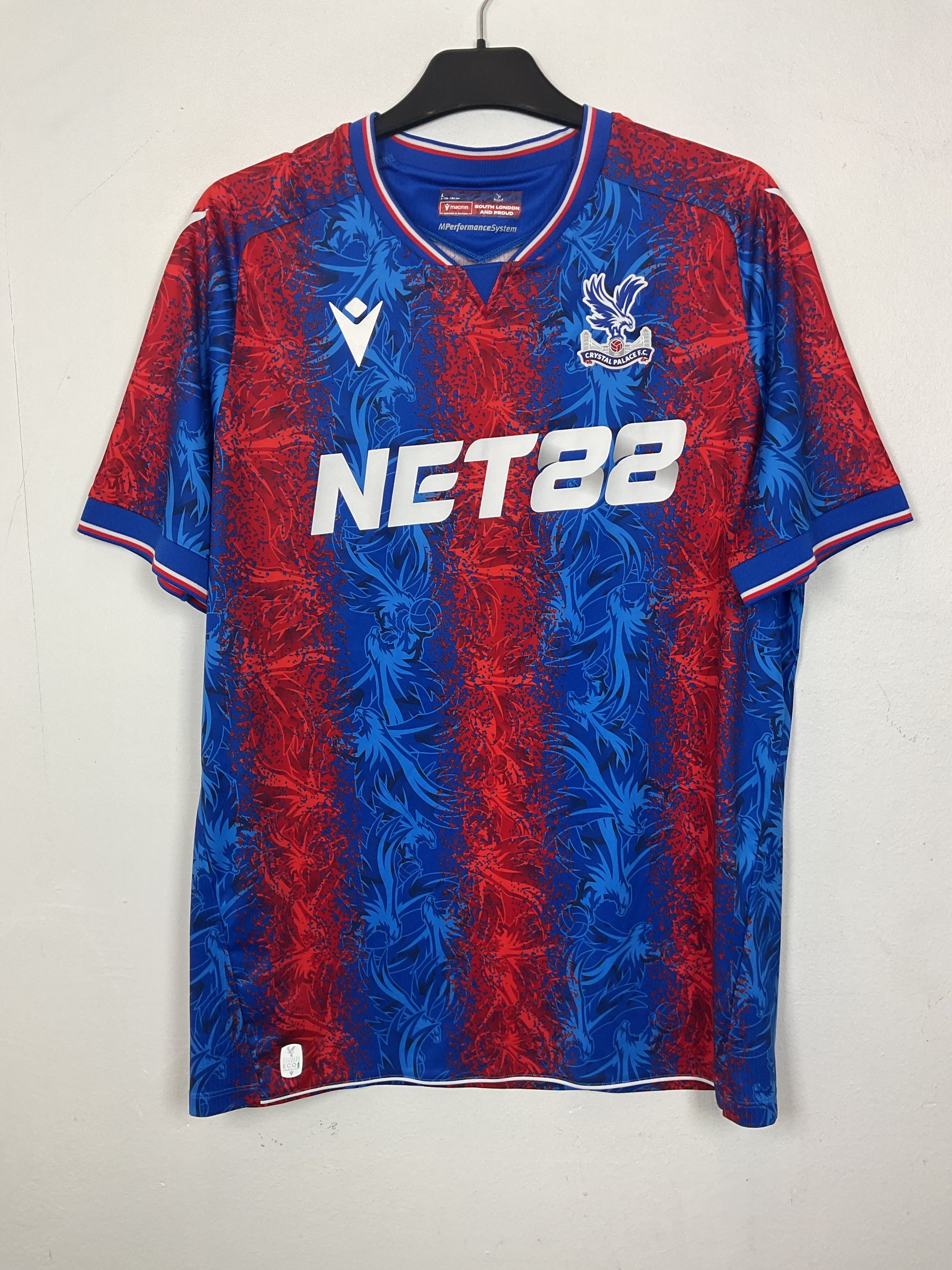 Blue and redpremier league t shirts with visible branding on a light gray background