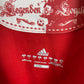 Bayern Munich 10/11 home shirt — Adidas three stripes and FC Bayern crest close-up