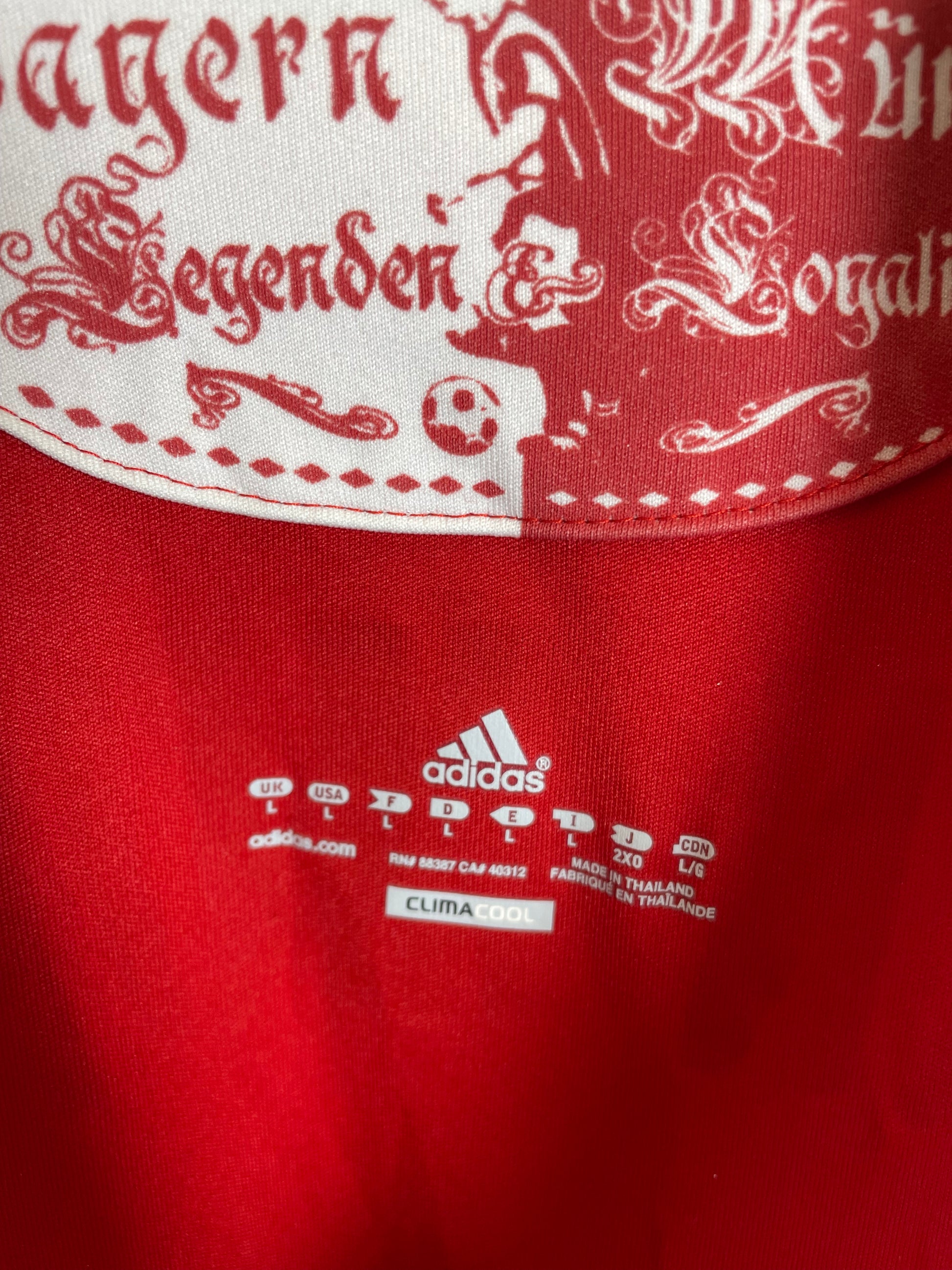 Bayern Munich 10/11 home shirt — Adidas three stripes and FC Bayern crest close-up