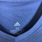 Close-up of Adidas logo and Bordeaux club badge on navy blue home shirt 20/21