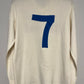 White long-sleeve napoli 80s football shirt with a blue number 7 on a gray background