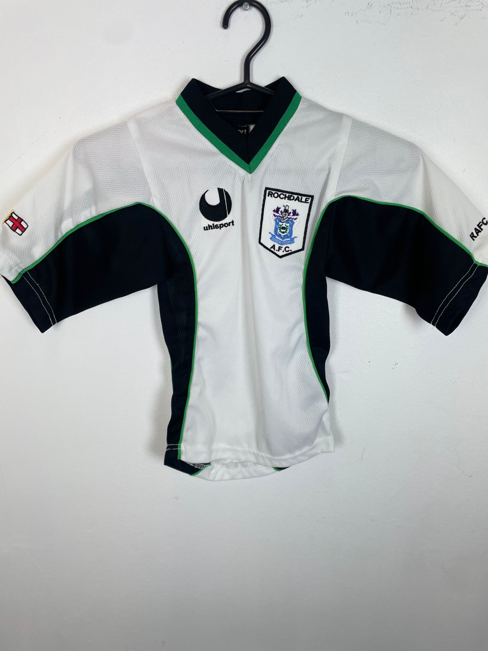 Uhlsport Rochdale AFC home football shirt in kids sizing with the club crest displayed, genuine original football shirt
