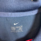 Close-up of Nike logo and Barcelona club badge on 02/04 third shirt with Ronaldinho 10