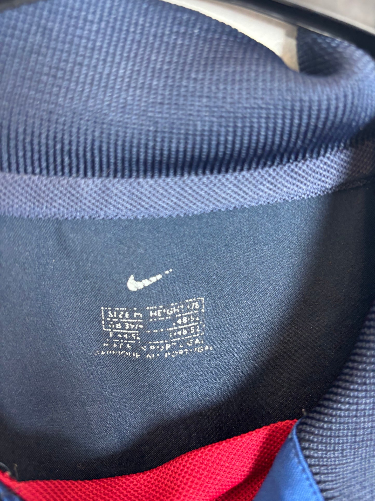 Close-up of Nike logo and Barcelona club badge on 02/04 third shirt with Ronaldinho 10