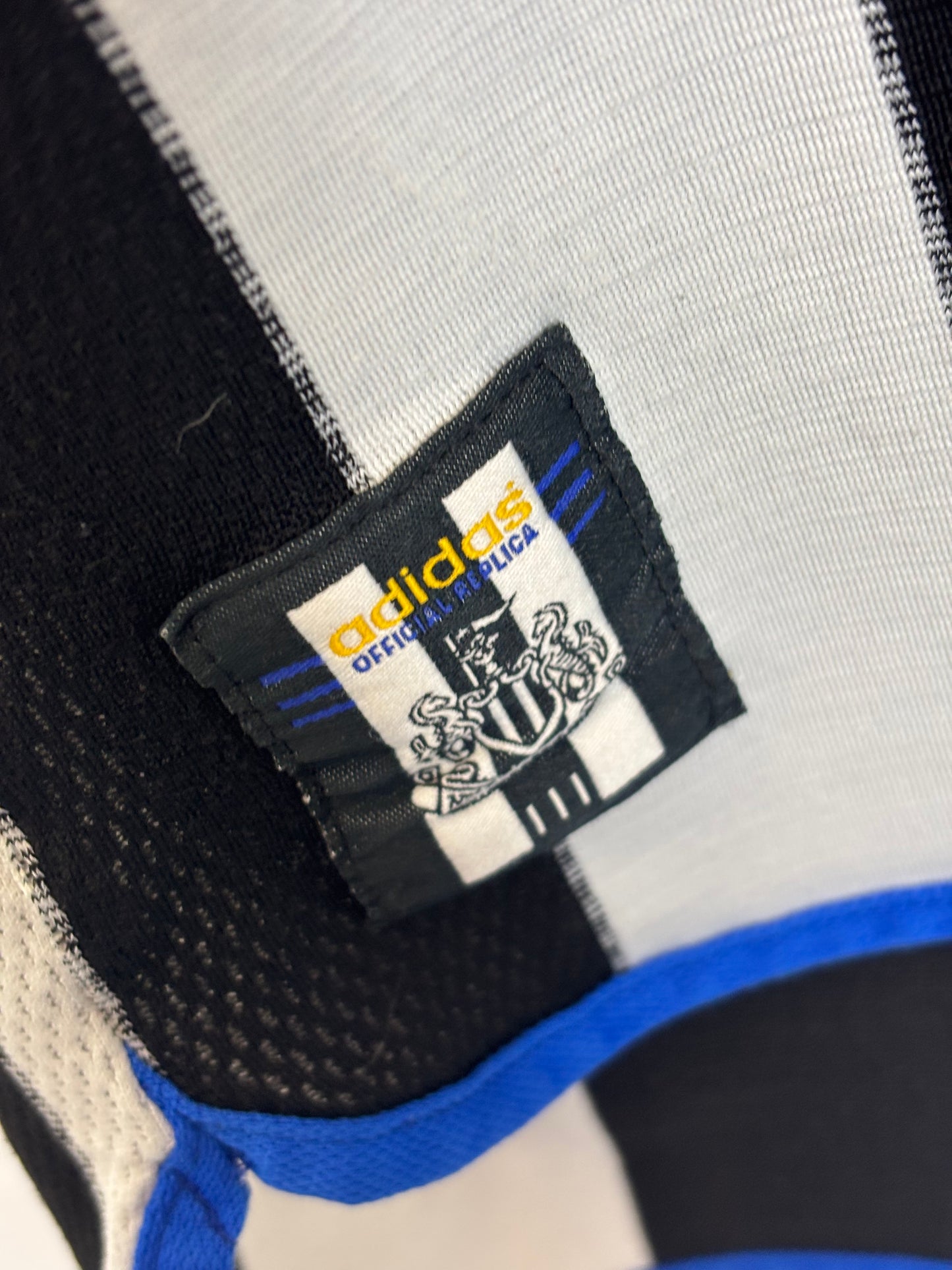 Newcastle United 00/01 home shirt size and care label detail showing Adidas branding