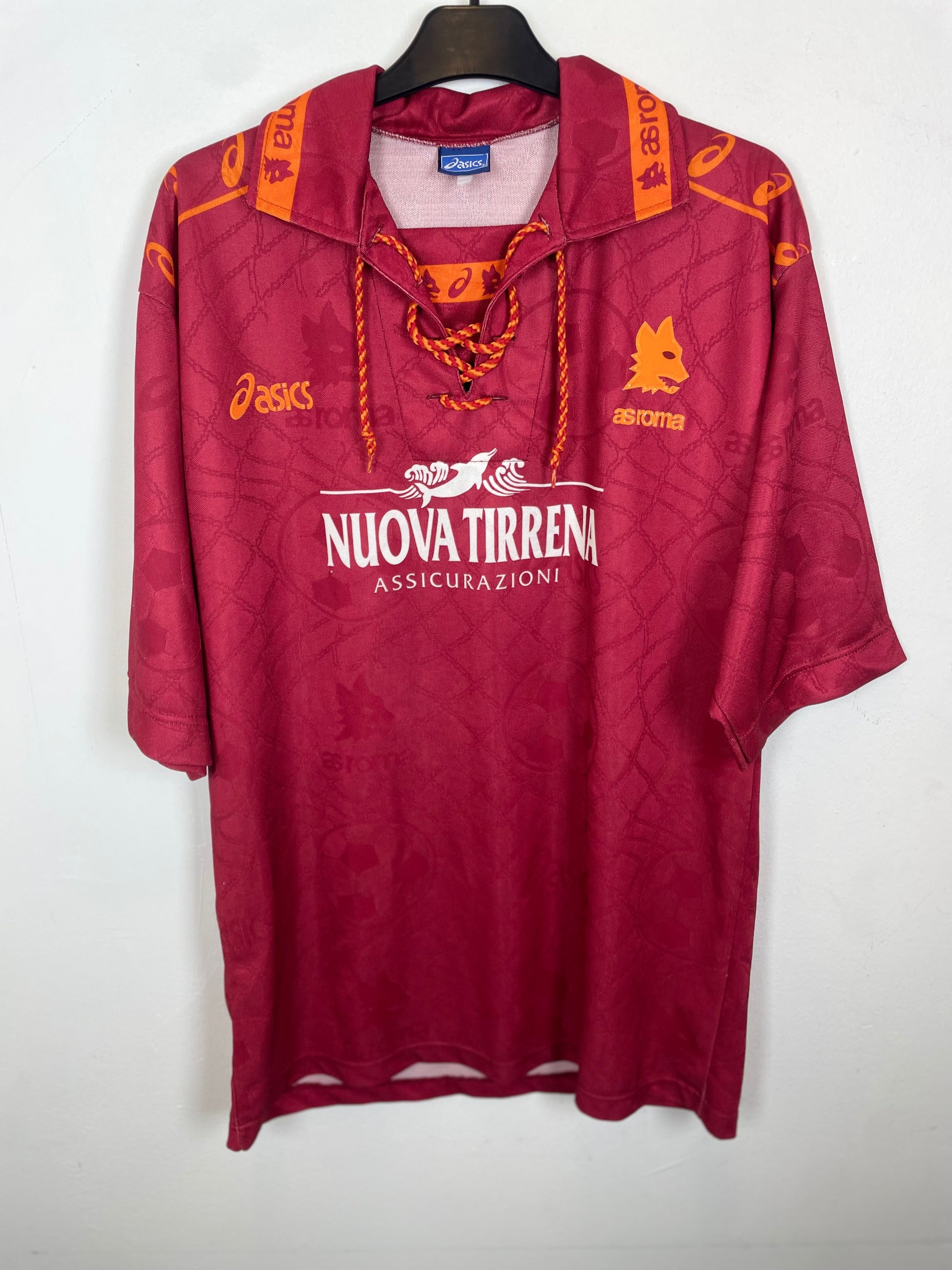 Maroon as roma shirtwith orange accents and brand logos on a white background