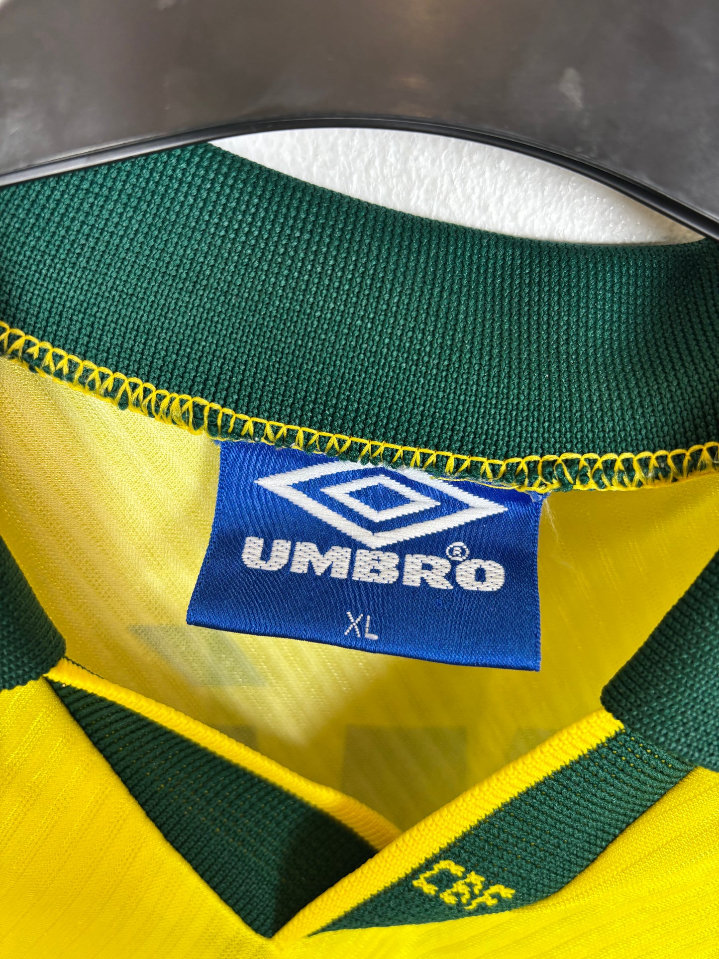 Close-up of Brazil national team crest and Umbro logo on yellow 1996 home jersey