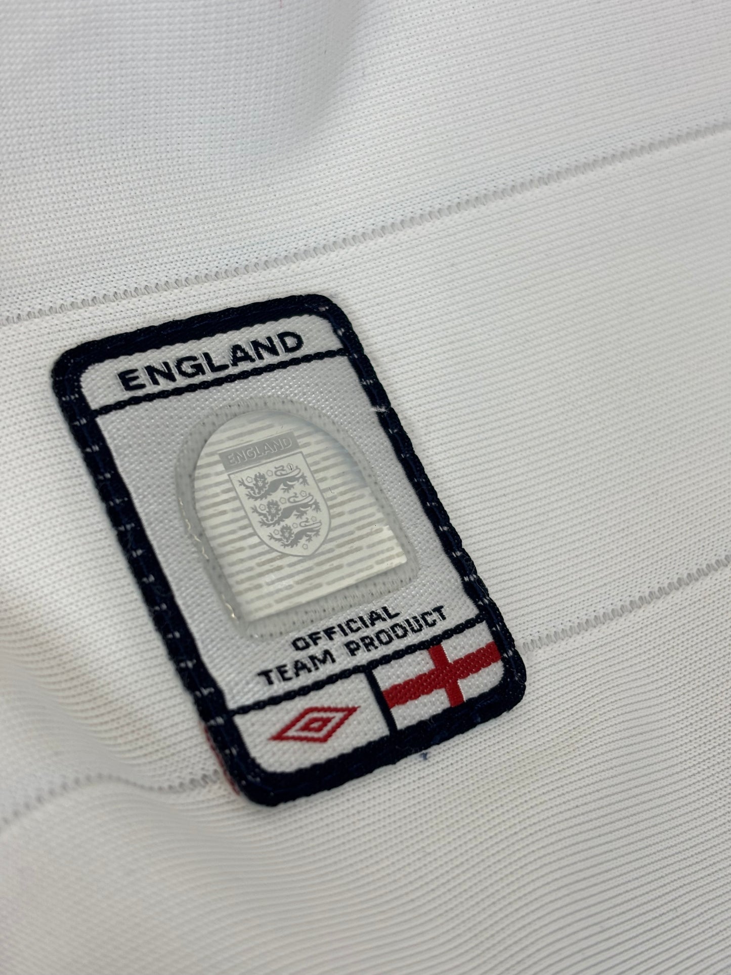 England 2003/05 home shirt sponsor and Three Lions badge detail with Umbro branding