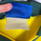 Detail view of Umbro Brazil 1993 home shirt fabric texture and vintage construction quality