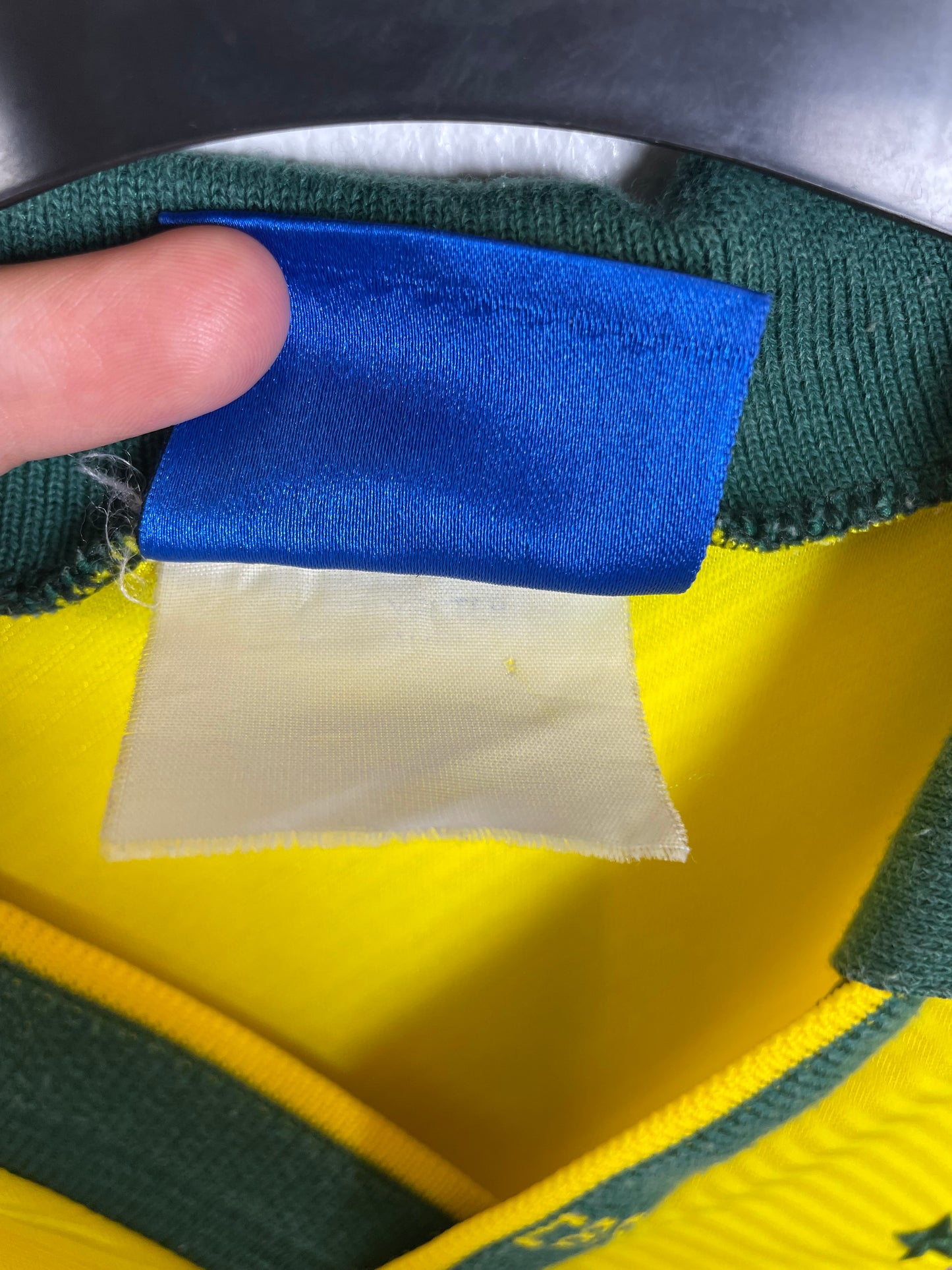 Detail view of Umbro Brazil 1993 home shirt fabric texture and vintage construction quality