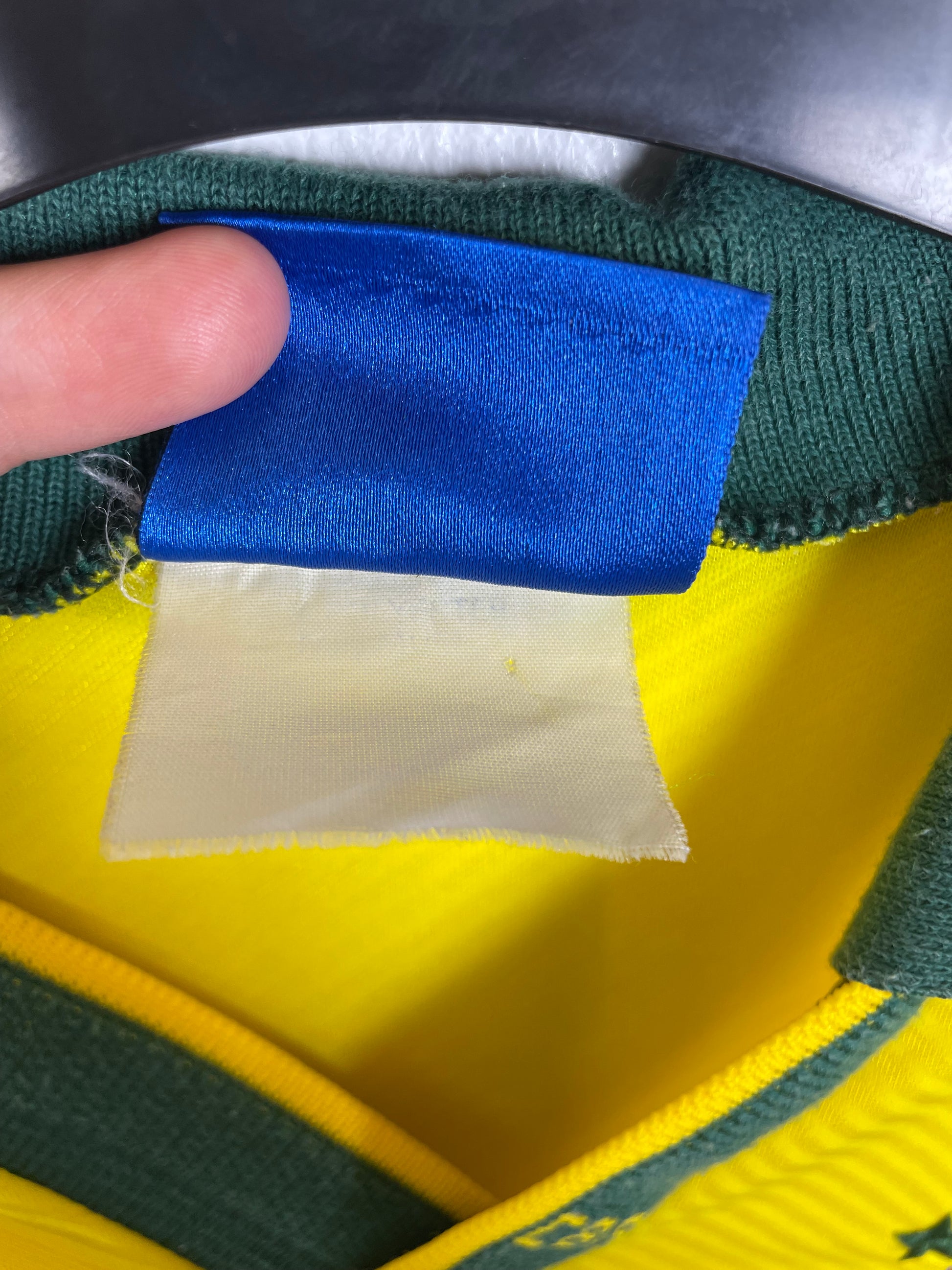 Detail view of Umbro Brazil 1993 home shirt fabric texture and vintage construction quality