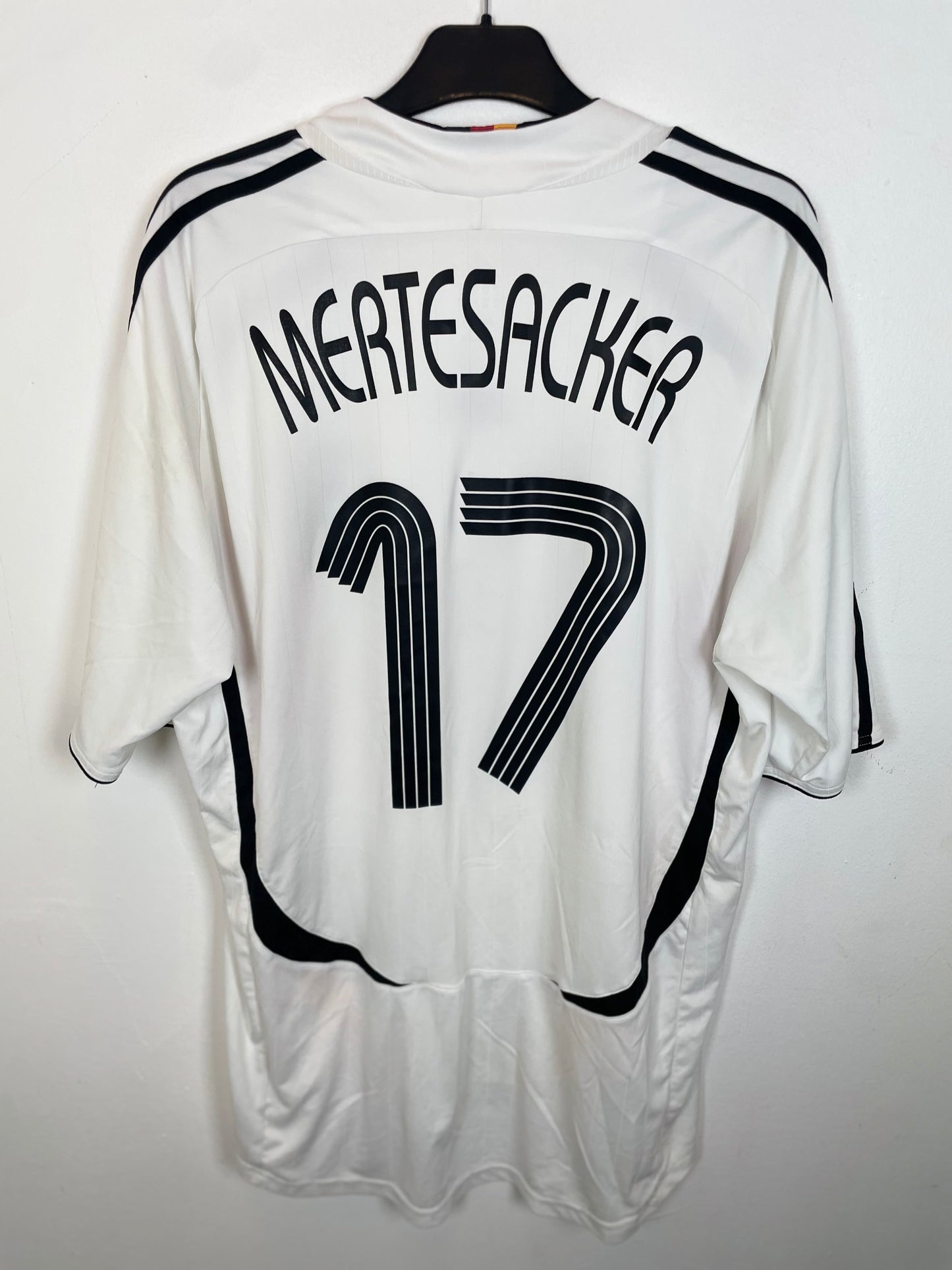 Back view of Germany 2006 home jersey displaying Mertesacker name and number 17 in black print