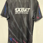Black sports jersey with '1XBAT Sporting Lines' logo on a beige background