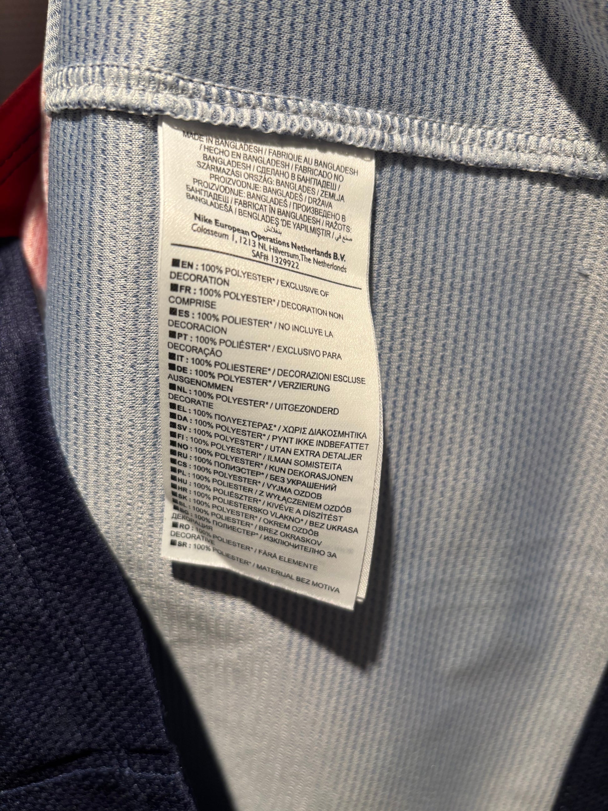 Close-up of a label on a gray fabric surface