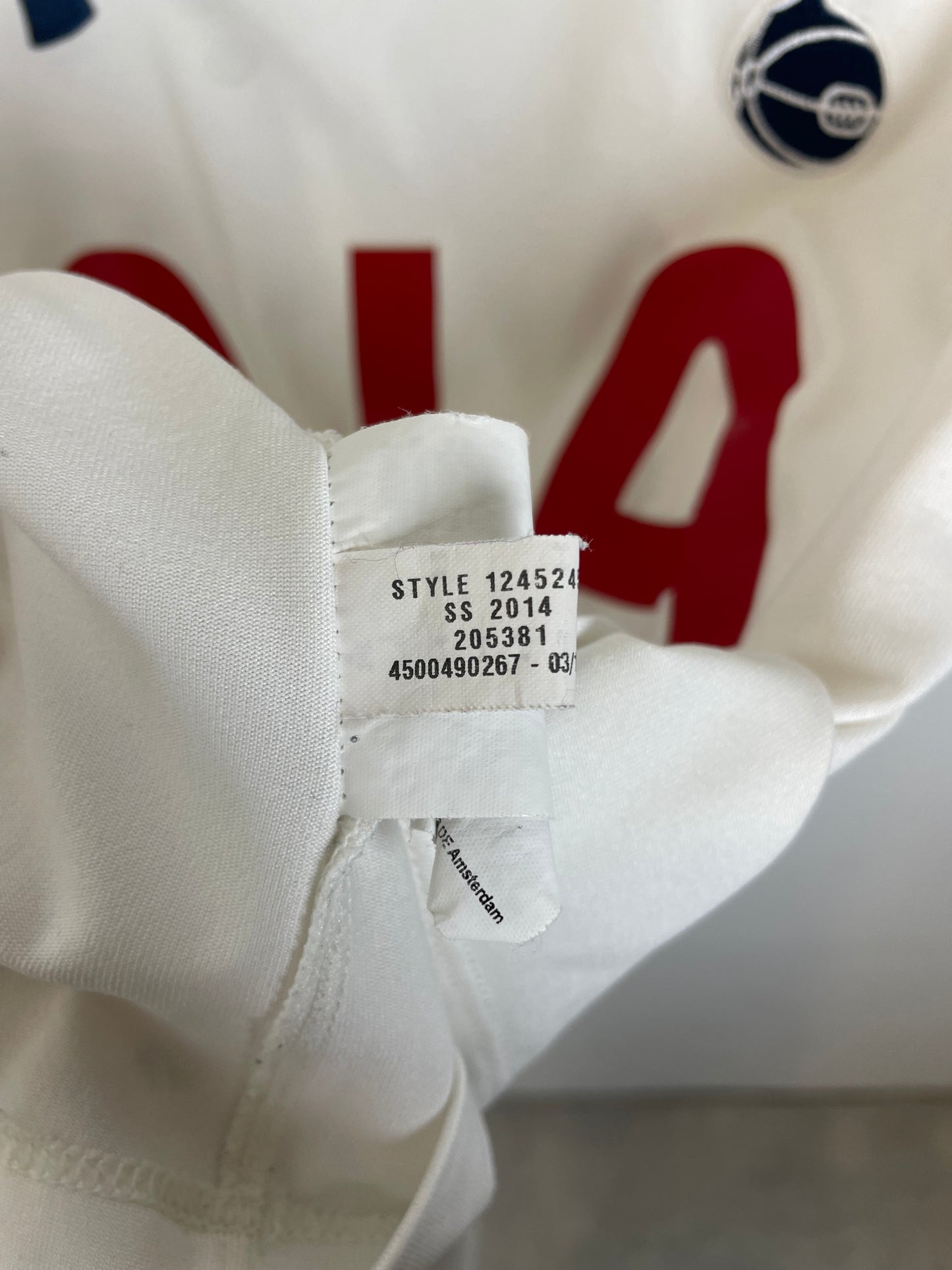 Under Armour Tottenham 2014/15 home shirt interior label showing size M and authenticity tags