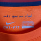 Close-up of Nike swoosh logo and FC Barcelona club crest on 12/13 away kit
