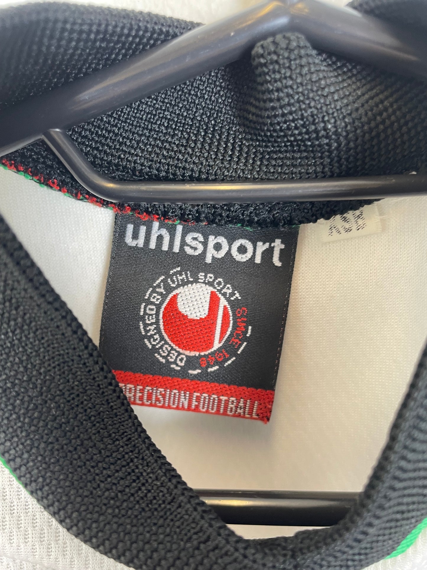 Back of the Uhlsport Rochdale AFC youth home football shirt without nameset, 9/10 condition, shown in full rear detail