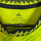 Close-up of Manchester United third shirt 22/23 showing club badge and shirt details