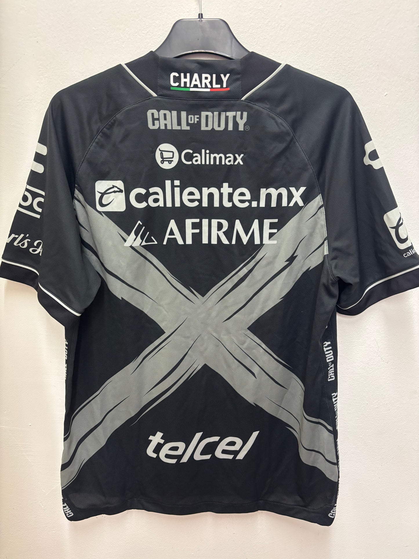 Black  Club Tijuana call of duty shirt with various logos on a light background