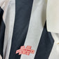 Close-up of Matchwinner logo and St Mirren club badge on 1993/94 home shirt