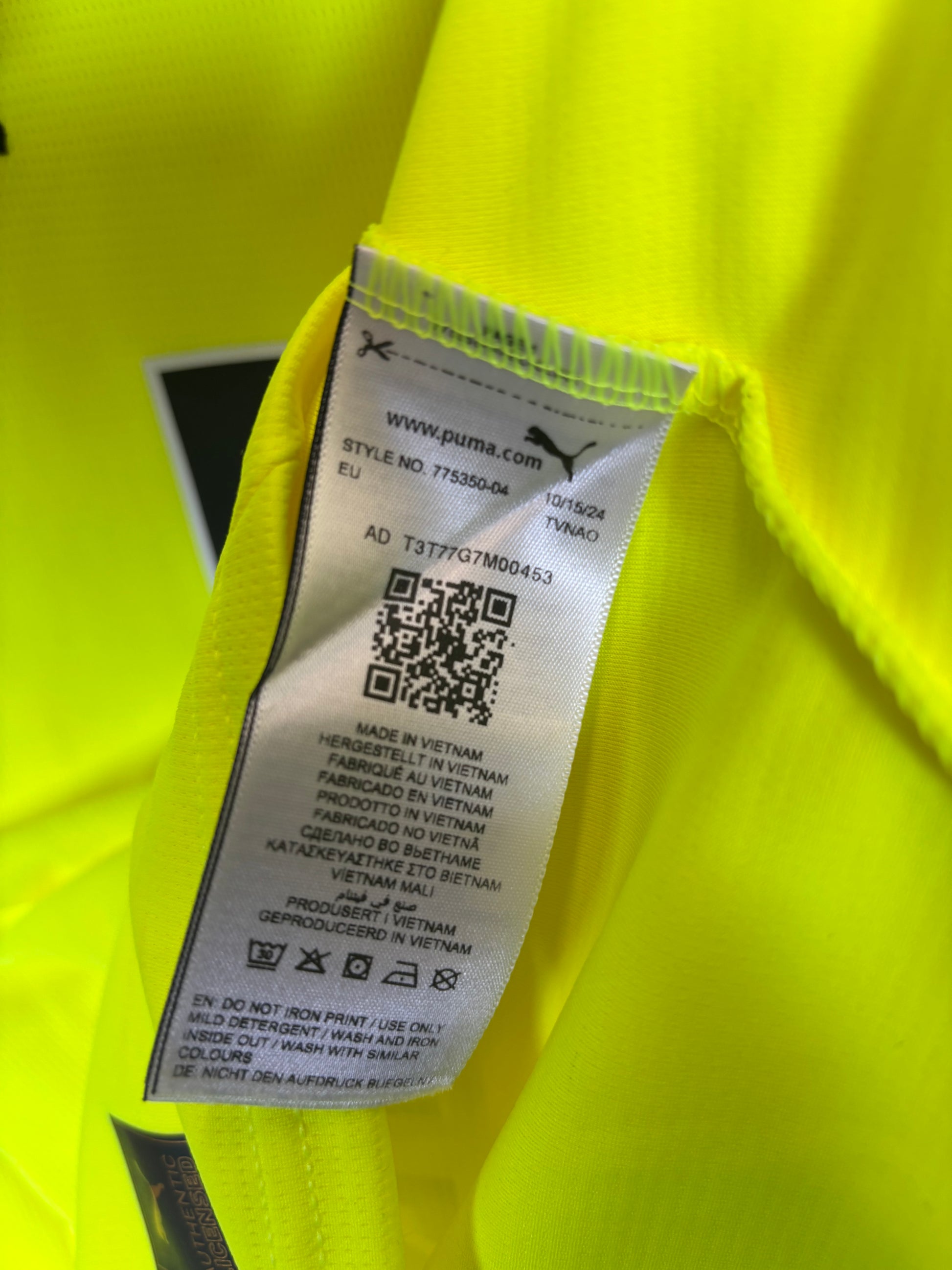Sponsor logo and fabric texture details on Puma Borussia Dortmund 2024/25 home jersey
